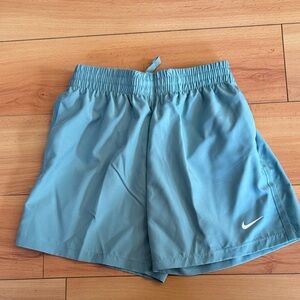 Nike Kids Standard Fit Dri-Fit teal shorts